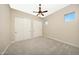 Bright bedroom with double door closets and neutral carpeting at 20594 W Pasadena Ave, Buckeye, AZ 85396
