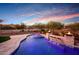 Inviting pool and spa with fire pit and mountain views at 20594 W Pasadena Ave, Buckeye, AZ 85396