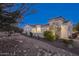 Stunning desert home exterior at dusk at 20594 W Pasadena Ave, Buckeye, AZ 85396