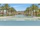 Resort-style pool with palm trees and mountain views at 20594 W Pasadena Ave, Buckeye, AZ 85396