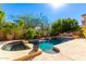 Expansive pool with spa and surrounding landscape at 13499 E Cannon Dr, Scottsdale, AZ 85259