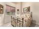 Bright bedroom featuring a floral bedspread and large window at 13499 E Cannon Dr, Scottsdale, AZ 85259