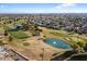 Aerial view of golf course with pond and fountain at 10452 W Meade Dr, Sun City, AZ 85351