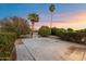 Landscaped backyard with patio and water feature at 10452 W Meade Dr, Sun City, AZ 85351