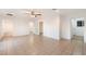 Bedroom with tile floors, ceiling fan and access to bathroom and other rooms at 10452 W Meade Dr, Sun City, AZ 85351