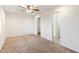 Bright bedroom with carpeted floors and ceiling fan at 10452 W Meade Dr, Sun City, AZ 85351