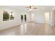 Bedroom with tile floors, ceiling fan, and access to backyard at 10452 W Meade Dr, Sun City, AZ 85351