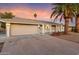 House exterior view at dusk featuring a neutral color scheme at 10452 W Meade Dr, Sun City, AZ 85351