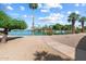 Peaceful lakefront view with walking path at 10452 W Meade Dr, Sun City, AZ 85351