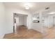 Open concept living and dining area with light floors and neutral walls at 10452 W Meade Dr, Sun City, AZ 85351