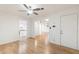 Light and airy living room with hardwood floors and ceiling fan at 10452 W Meade Dr, Sun City, AZ 85351
