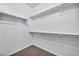 Spacious walk-in closet with double hanging rods and shelving at 16002 W Jenan Dr, Surprise, AZ 85379