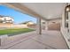 Spacious covered patio overlooking the backyard at 16002 W Jenan Dr, Surprise, AZ 85379