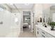 Main bathroom with walk-in shower and bedroom view at 25353 N 134Th Dr, Peoria, AZ 85383