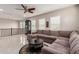 Bright bonus room featuring L-shaped sectional sofa and large windows at 4526 E Vista Bonita Dr, Phoenix, AZ 85050