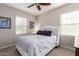 Cozy bedroom with a queen-size bed and window blinds at 4526 E Vista Bonita Dr, Phoenix, AZ 85050