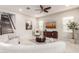 Open concept living room with curved sofa and staircase at 4526 E Vista Bonita Dr, Phoenix, AZ 85050