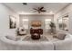 Spacious living room with a large sectional sofa, TV, and ceiling fan at 4526 E Vista Bonita Dr, Phoenix, AZ 85050