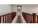 Upstairs hallway with hardwood flooring and elegant runner at 4526 E Vista Bonita Dr, Phoenix, AZ 85050