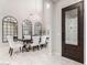 Elegant dining room with chandelier, large table, and decorative mirrors at 4526 E Vista Bonita Dr, Phoenix, AZ 85050