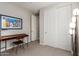 Bright home office features built-in shelving and a large desk at 4526 E Vista Bonita Dr, Phoenix, AZ 85050