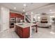 Modern kitchen with large island, stainless steel appliances, and granite countertops at 4526 E Vista Bonita Dr, Phoenix, AZ 85050