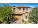 Two-story house with stone accents and a three-car garage at 4526 E Vista Bonita Dr, Phoenix, AZ 85050