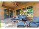 Covered patio with comfortable seating and a ceiling fan at 4526 E Vista Bonita Dr, Phoenix, AZ 85050