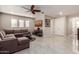 Spacious Gathering room with L-shaped sectional sofa and large TV at 4526 E Vista Bonita Dr, Phoenix, AZ 85050