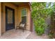 Charming front patio with an iron gate and a cozy bench at 4526 E Vista Bonita Dr, Phoenix, AZ 85050