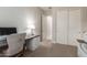 Modern home office with a large desk and built-in cabinetry at 4526 E Vista Bonita Dr, Phoenix, AZ 85050