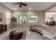 Bright living room showcasing a curved sofa and backyard view at 4526 E Vista Bonita Dr, Phoenix, AZ 85050
