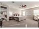 Main bedroom with plush bed and sitting area at 4526 E Vista Bonita Dr, Phoenix, AZ 85050
