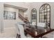 Elegant dining room featuring a dark wood table, chandelier, and stylish decor at 4526 E Vista Bonita Dr, Phoenix, AZ 85050
