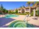 Inviting community pool and spa area with lounge chairs and patio umbrellas at 8653 E Royal Palm Rd # 2003, Scottsdale, AZ 85258