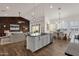 Open concept kitchen with island and modern lighting at 357 W Haxtun St, San Tan Valley, AZ 85143