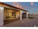 Covered patio with seating area and string lights at 357 W Haxtun St, San Tan Valley, AZ 85143