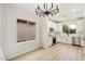 Modern white kitchen with stainless steel appliances and island at 10802 E Secret Canyon Rd, Gold Canyon, AZ 85118