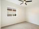 Simple bedroom with ceiling fan and a window providing natural light at 10802 E Secret Canyon Rd, Gold Canyon, AZ 85118