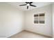 Cozy bedroom with ceiling fan and window offering natural light at 10802 E Secret Canyon Rd, Gold Canyon, AZ 85118