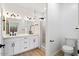 Elegant bathroom featuring a double vanity, walk-in shower, and separate toilet area at 10802 E Secret Canyon Rd, Gold Canyon, AZ 85118