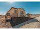 Side yard view showcasing landscaping and exterior finishes at 13637 W Hackamore Dr, Peoria, AZ 85383