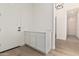 Entryway with built-in storage and wood-look flooring at 13637 W Hackamore Dr, Peoria, AZ 85383