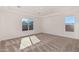 Spacious bedroom with two large windows and neutral carpet at 13637 W Hackamore Dr, Peoria, AZ 85383