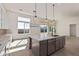 Modern kitchen with large island and stainless steel appliances at 13637 W Hackamore Dr, Peoria, AZ 85383