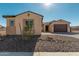 Landscaped front yard, two-car garage, and charming facade at 13637 W Hackamore Dr, Peoria, AZ 85383