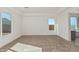 Bright and airy living room with large windows and neutral carpet at 13637 W Hackamore Dr, Peoria, AZ 85383