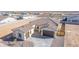 Aerial view of a single-story house with tile roof, two-car garage, and landscaped yard at 13637 W Hackamore Dr, Peoria, AZ 85383