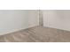 Bright bedroom with plush carpeting and an adjacent closet at 13637 W Hackamore Dr, Peoria, AZ 85383