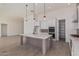 Modern kitchen with island, stainless steel appliances, and pantry at 13637 W Hackamore Dr, Peoria, AZ 85383